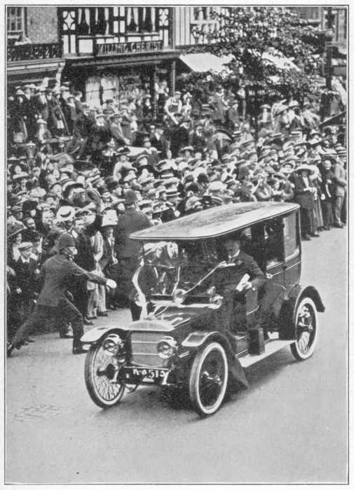 A SUFFRAGETTE THROWING A BAG OF FLOUR AT MR. ASQUITH IN
CHESTER