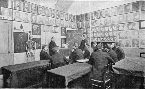 DETECTIVES RECEIVING A LECTURE ON THE METHOD OF
IDENTIFICATION BY NOSES.

From a Photo.